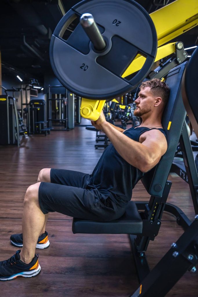Man using chest press machine in Congleton gym for strength training