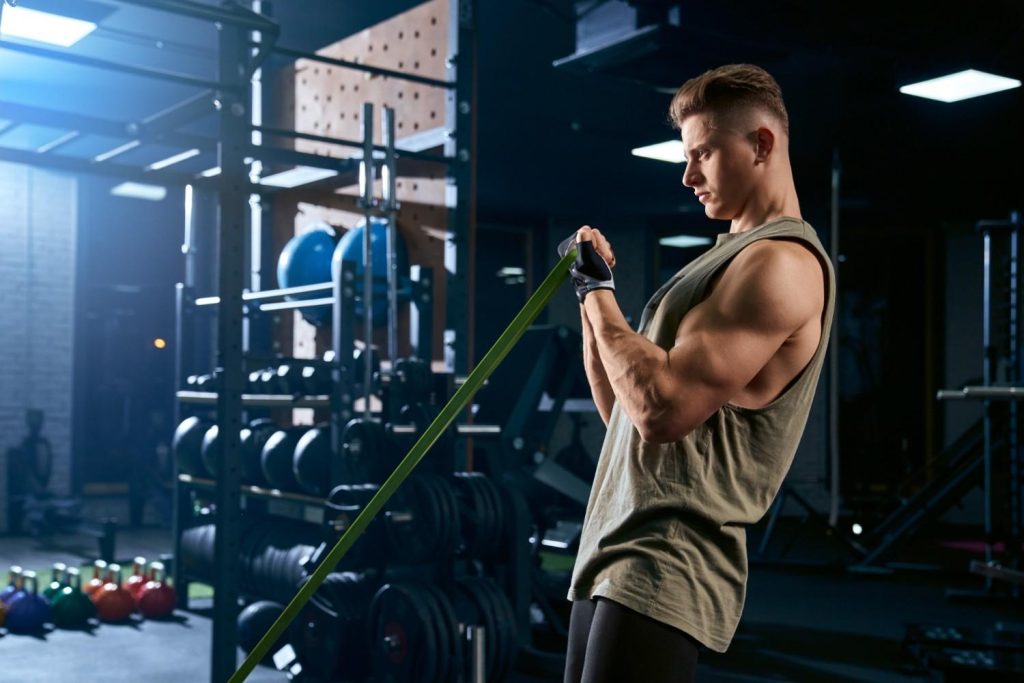 Man doing resistance band workout in Congleton gym for strength training